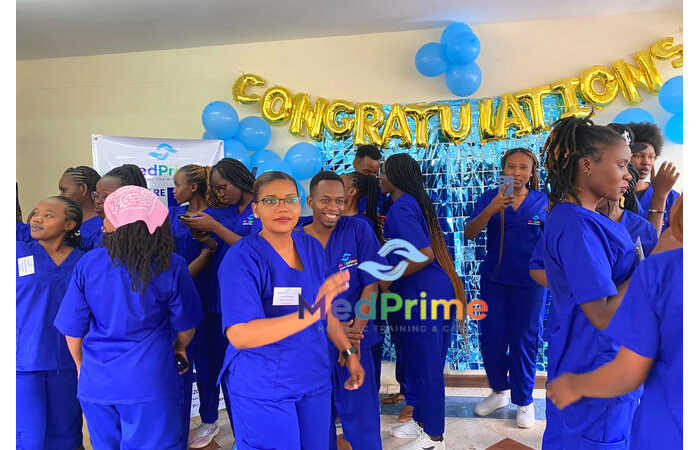 A student in graduation attire speaking at a podium during a ceremony
