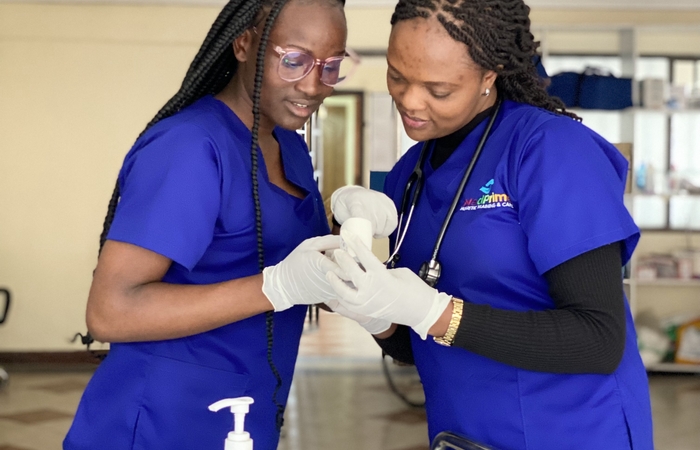 Students in scrubs posing
