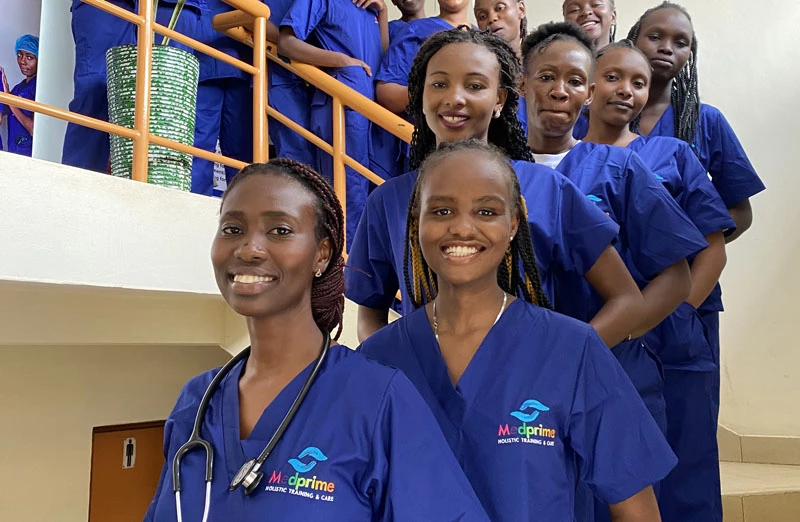 Happy students in scrubs